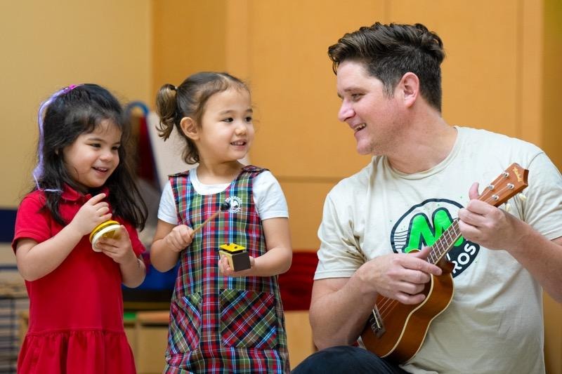 Michael making music with children