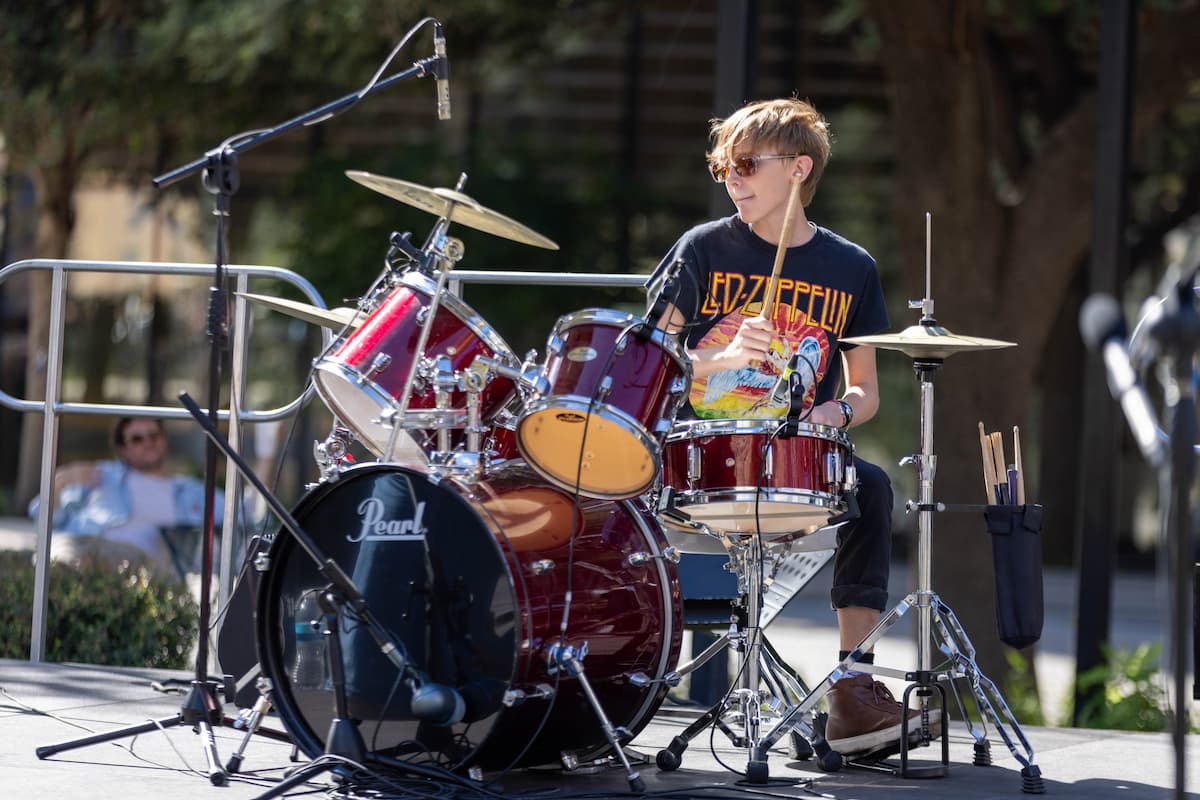 a student playing drums